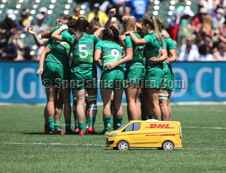 2018RugbySevensFri-11.JPG - The game ball is delivered by sponsor DHL's remote controlled truck in front of the women's Irish team at the 2018 Rugby World Cup Sevens, July 20-22, 2018, held at AT&T Park, San Francisco, CA.